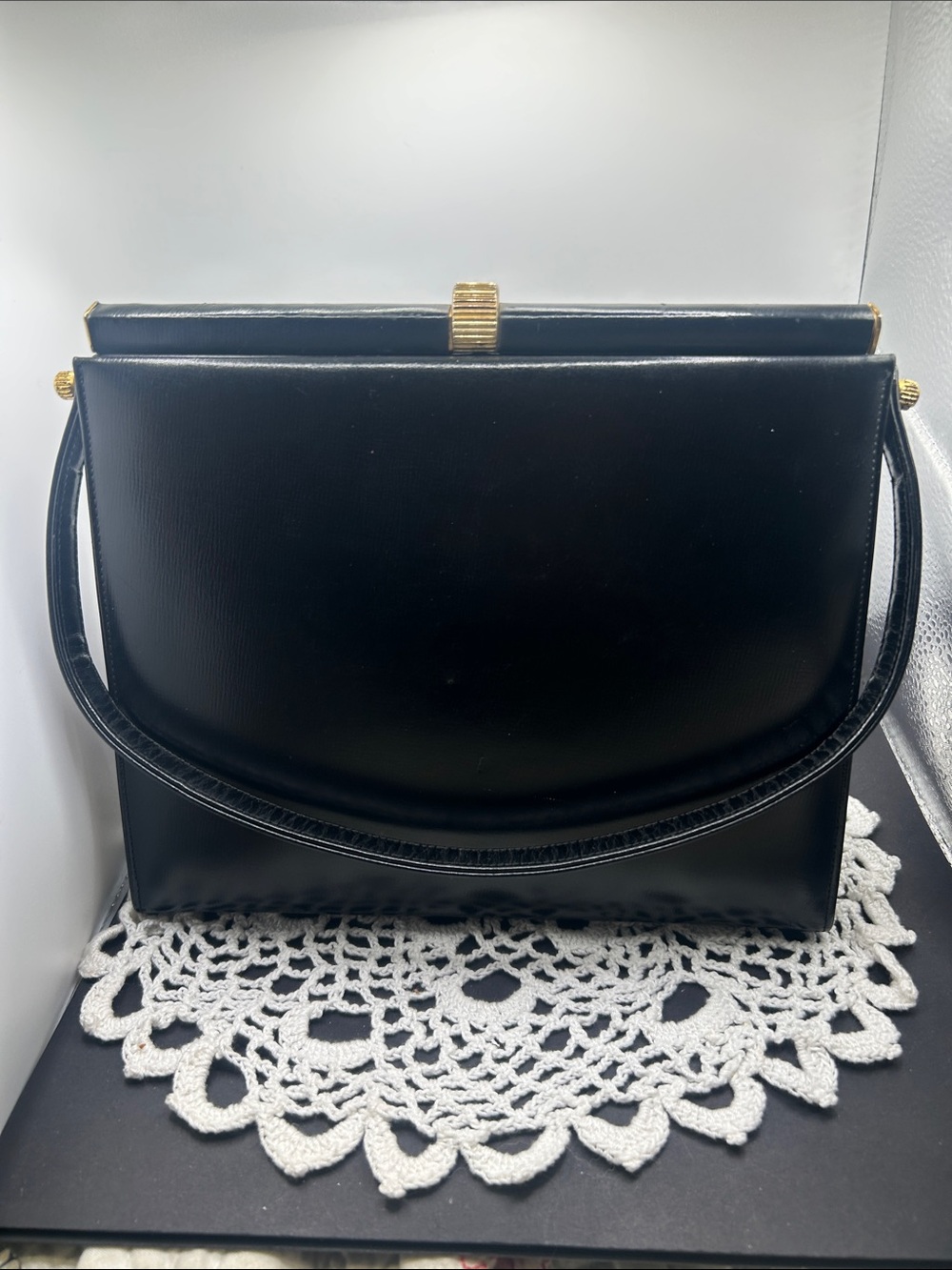 Elegant Black Shoulder Bag with Gold Accent